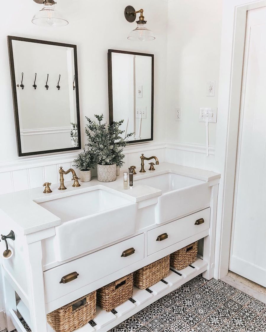 Jute storage baskets in Farmhouse Bathroom with double vanity via @lynzyandco