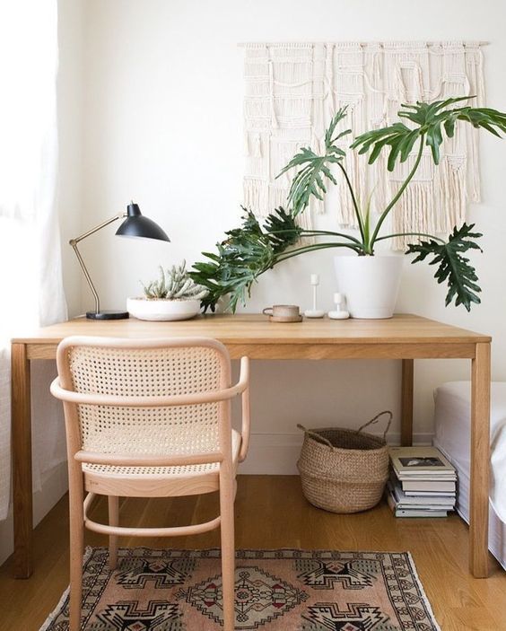 https://curatedinterior.com/wp-content/uploads/2021/01/Macrame-Wall-decoration-in-modern-boho-office-design-with-rattan-cane-back-chair-mid-century-modern-table-lamp-mango-wood-desk-pink-boho-rug.jpg