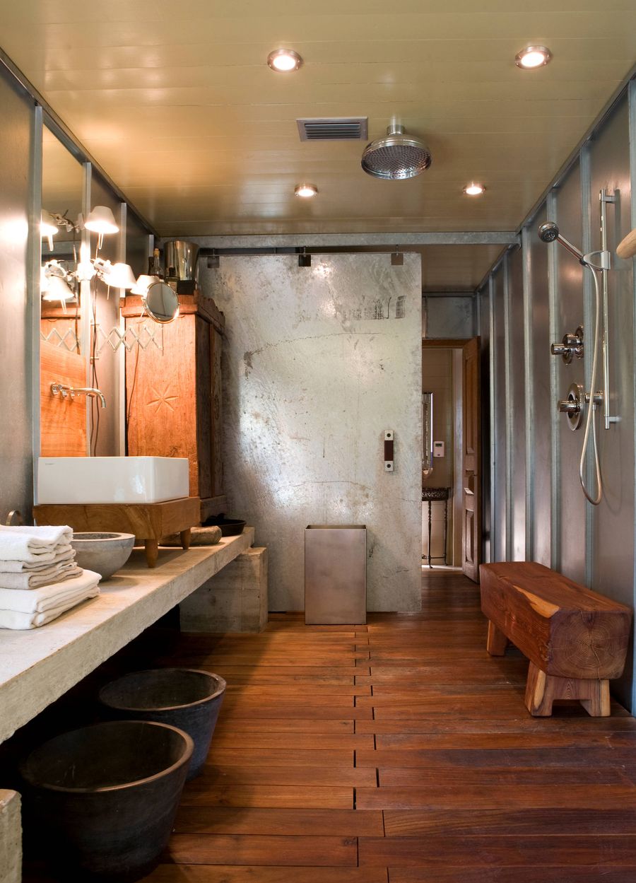 Metal Sliding Door Industrial bathroom design via Mell Lawrence Architects