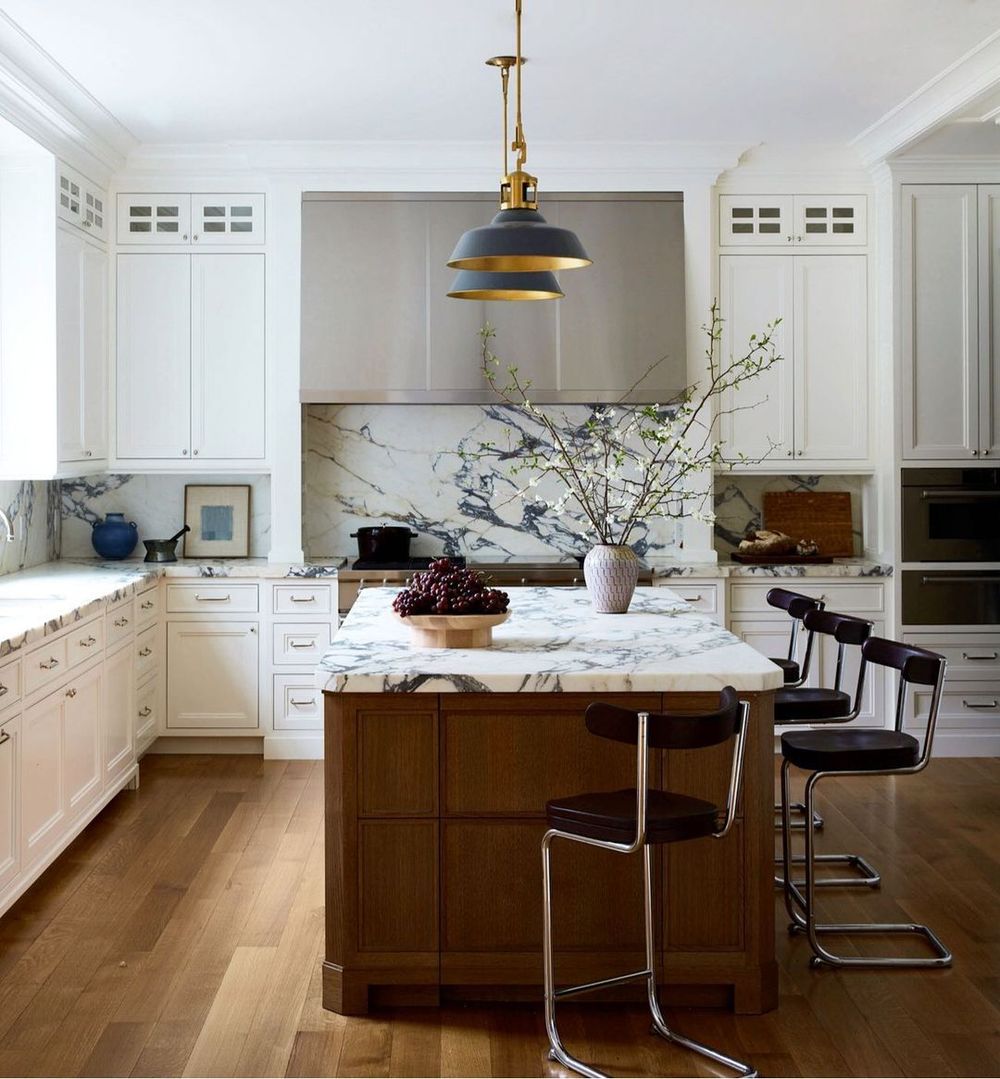Neutral Kitchen Decor with Contrasting Kitchen Island and Marble Countertops via @alyssakapitointeriors