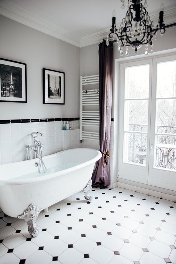 Paris Bathroom with White Clawfoot Tub and Towel Warming Rack on wall via KathyKuo