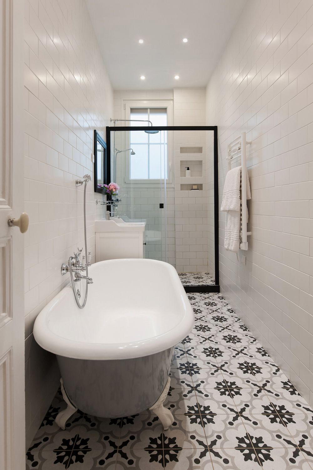 Parisian Bathroom decor with Clawfoot Tub and Towel warming rack on wall via havenin