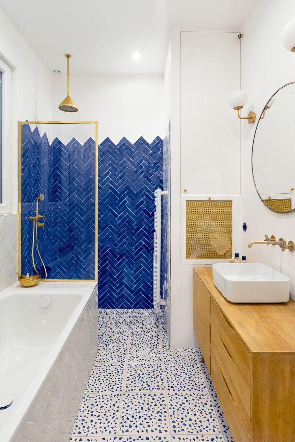Parisian bathroom with Ocean Blue Herringbone Tile Walls via Charlotte Fequet