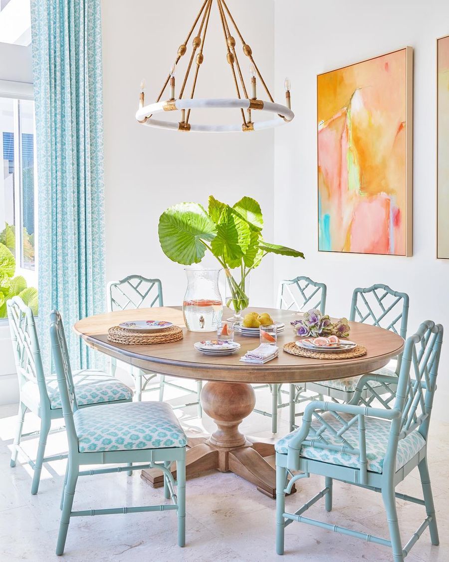 Pastel Blue Chairs and Abstract Art in Tropical Dining Room with via @karahebertinteriors