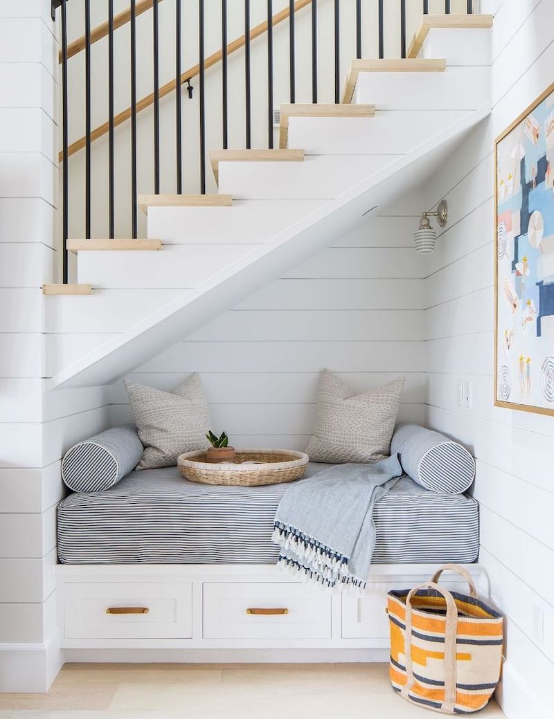 Reading Nook under the Staircase with drawers for storage via @brookewagnerdesign