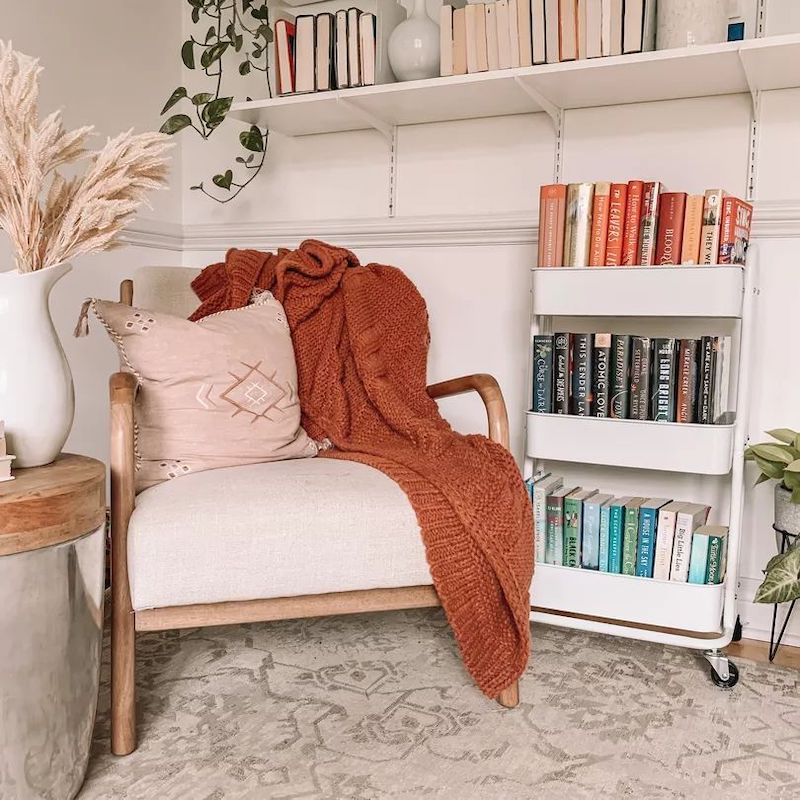 Reading Nook with Books on rolling metal cart via @lauren.m.mills