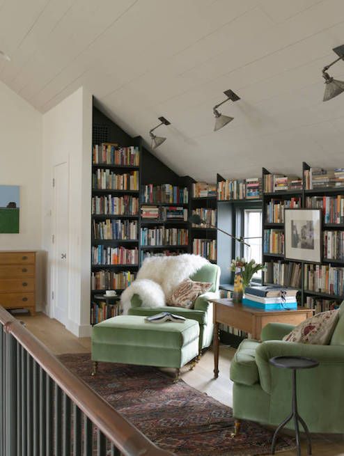 Reading Nook with Matching Green Accent Chairs and Black Shelves via Hendricks Churchill
