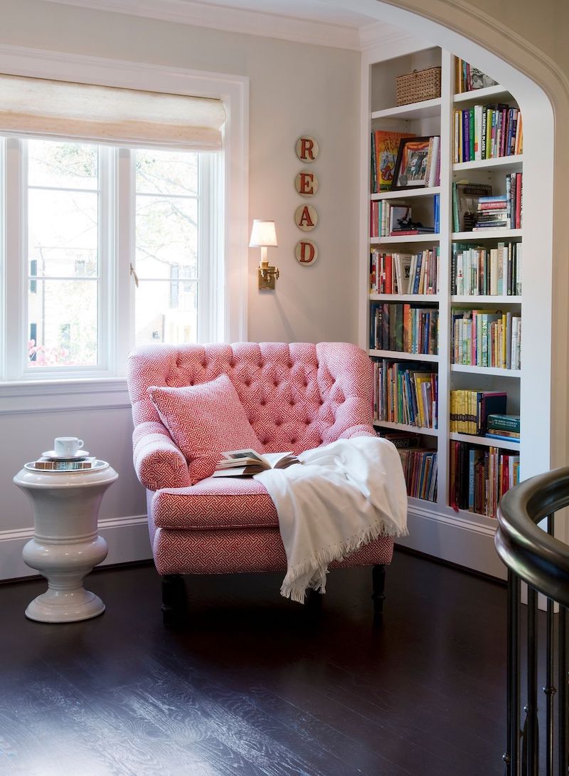 Reading Nook with Oversized Pink Tufted Accent Chair via Barnes Vanze Architects Inc