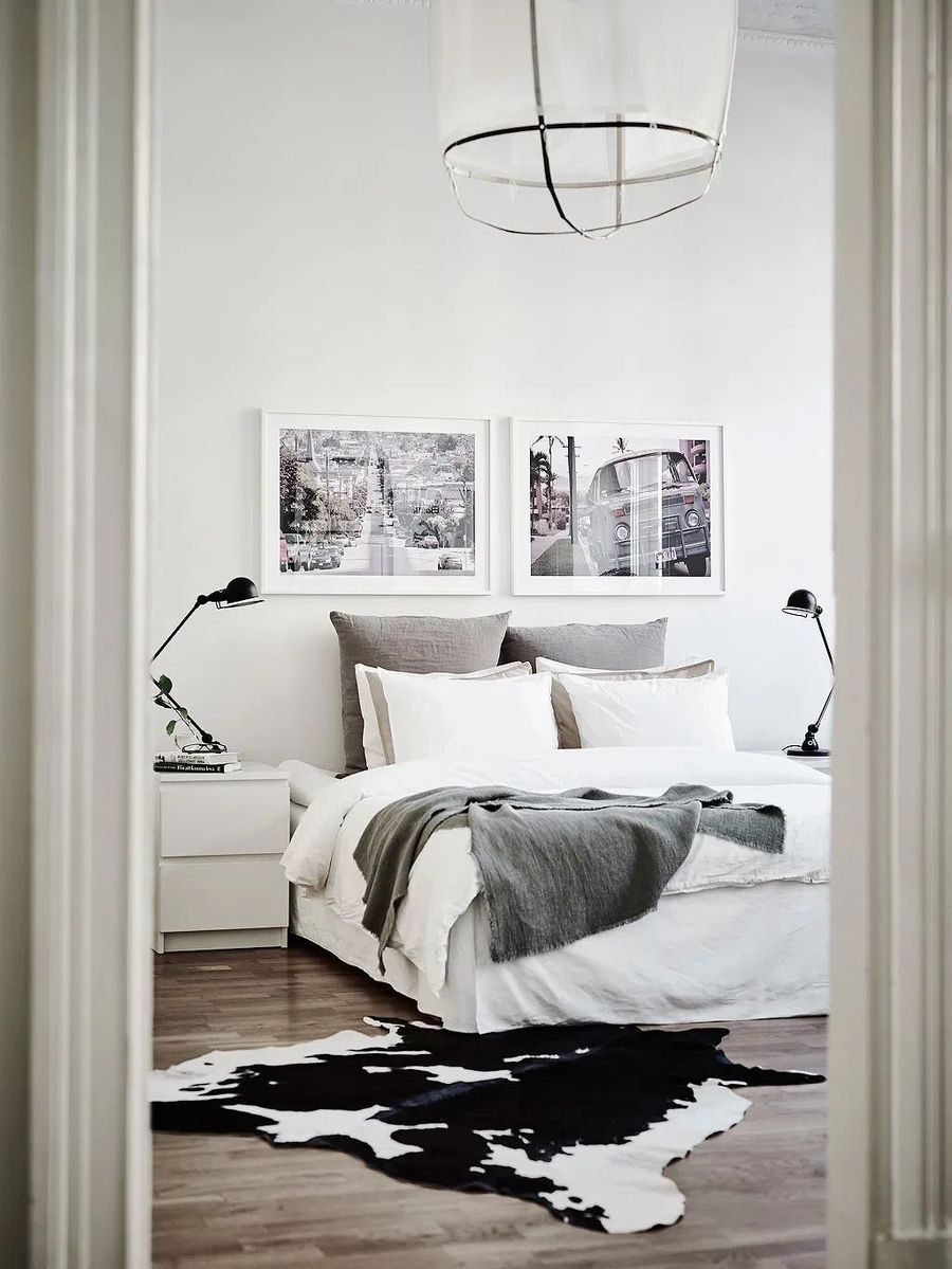 Scandinavian Bedroom with Cowhide rug via Entrance Makleri