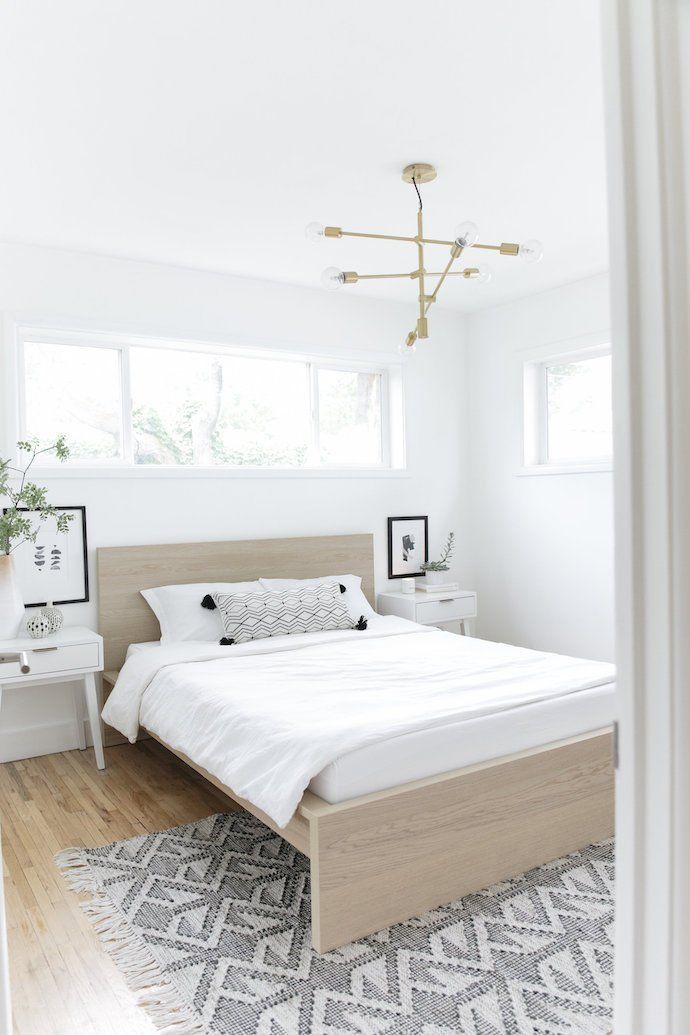 Scandinavian Bedroom with Neutral Wood Bed via Farah Prochaska