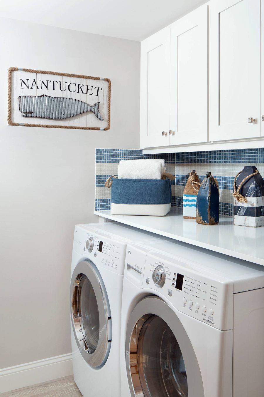 Striped Backsplash in nautical Nantucket Laundry Room via Lisa Michael Interiors