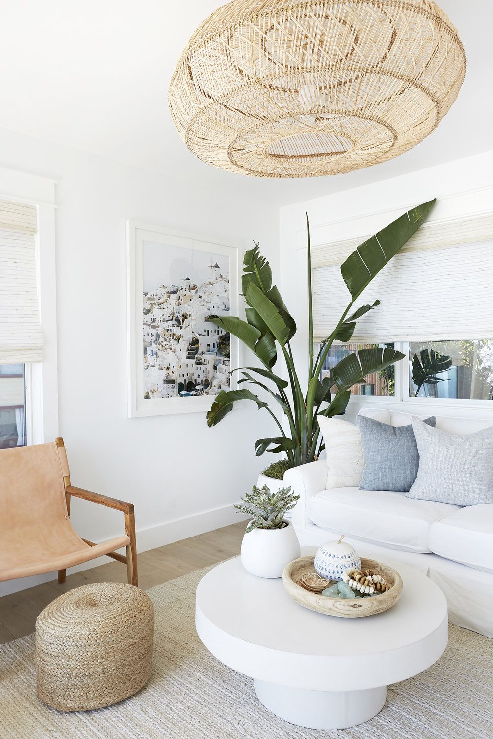 Tropical Living Room Decor with Rattan Ceiling Light and Jute Rug via Pure Salt Interiors