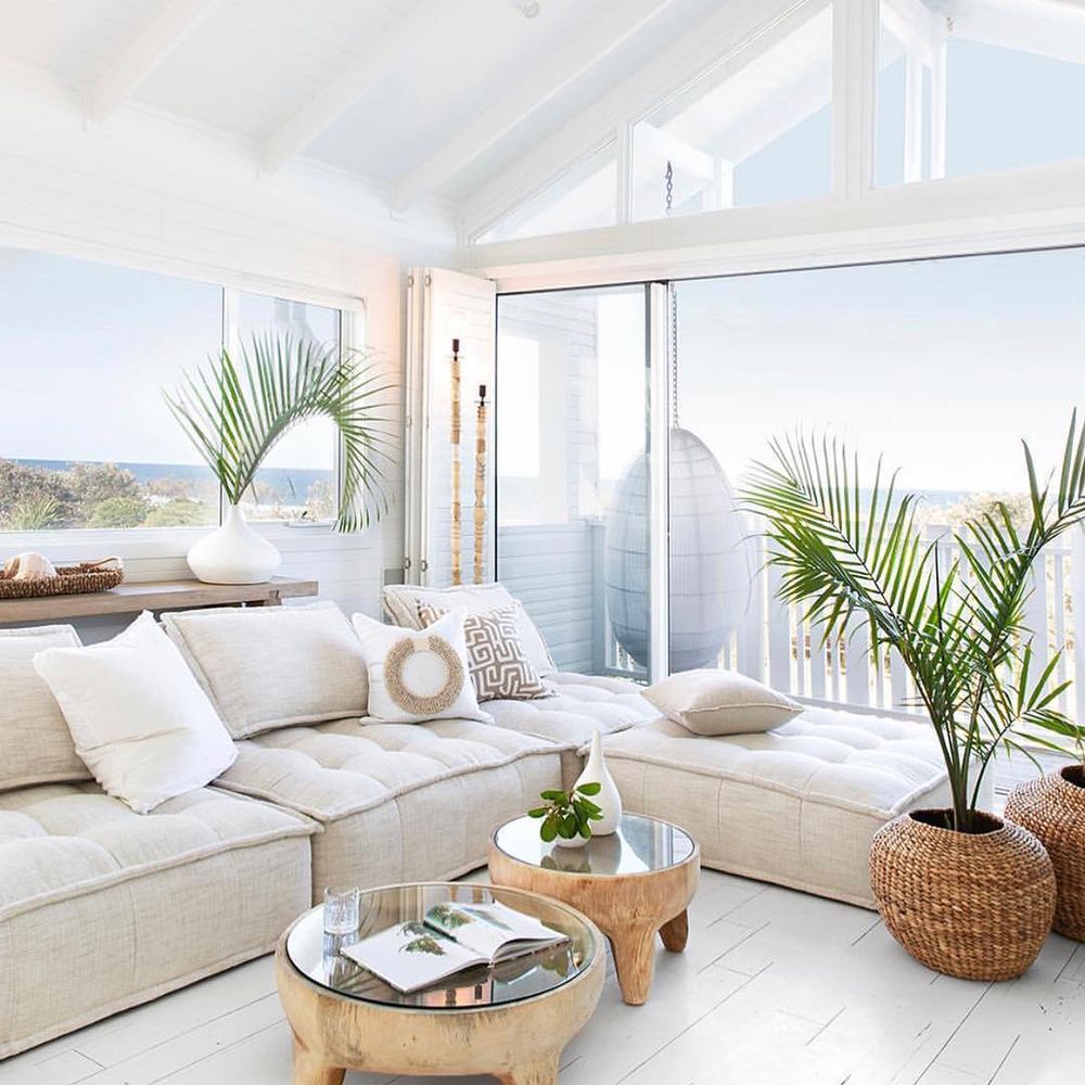 Tropical Living Room Decor with Tropical House Plants and Beige Sectional Sofa via @hamptonsholidayhouse