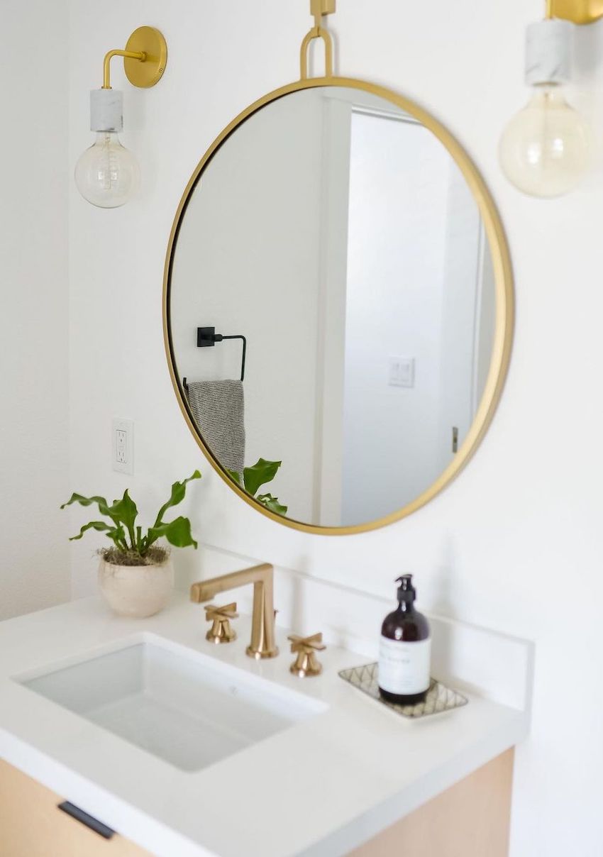 Twin sconces on either side of bathroom mirror via foxtaledesignbydenamazza