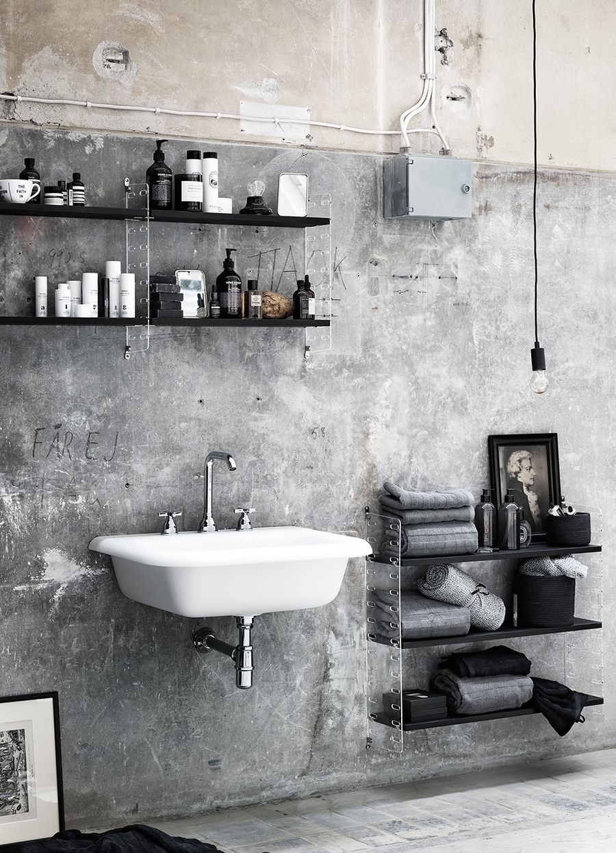 Unfinished Look Industrial Bathroom with Concrete Wall via Lotta Agaton for String Furniture