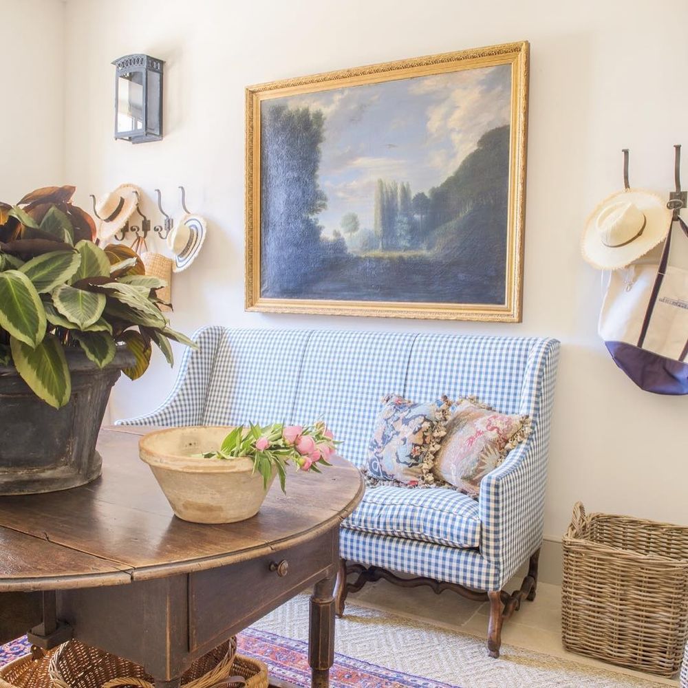 Upholstered Sofa Bench in a French Country Entryway Mudroom via @provencepoiriers
