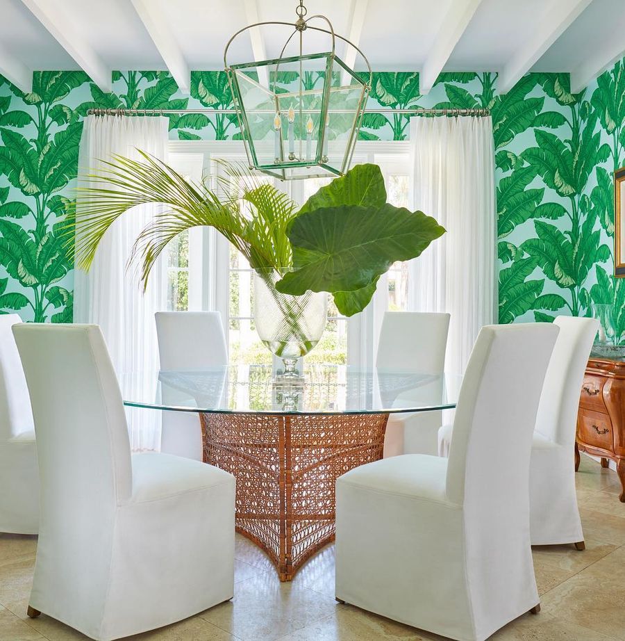 White Slipcover Dining Chairs in Tropical Dining Room via @ellenkavanaugh