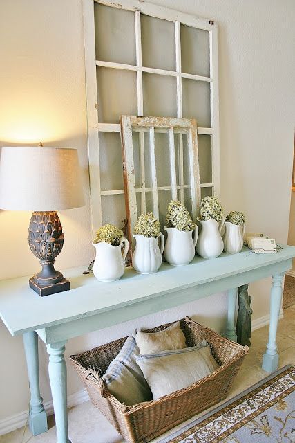 Accents like White Pitchers and Rustic Window Frames Farmhouse Entryway via farmhouseporch.blogspot.com