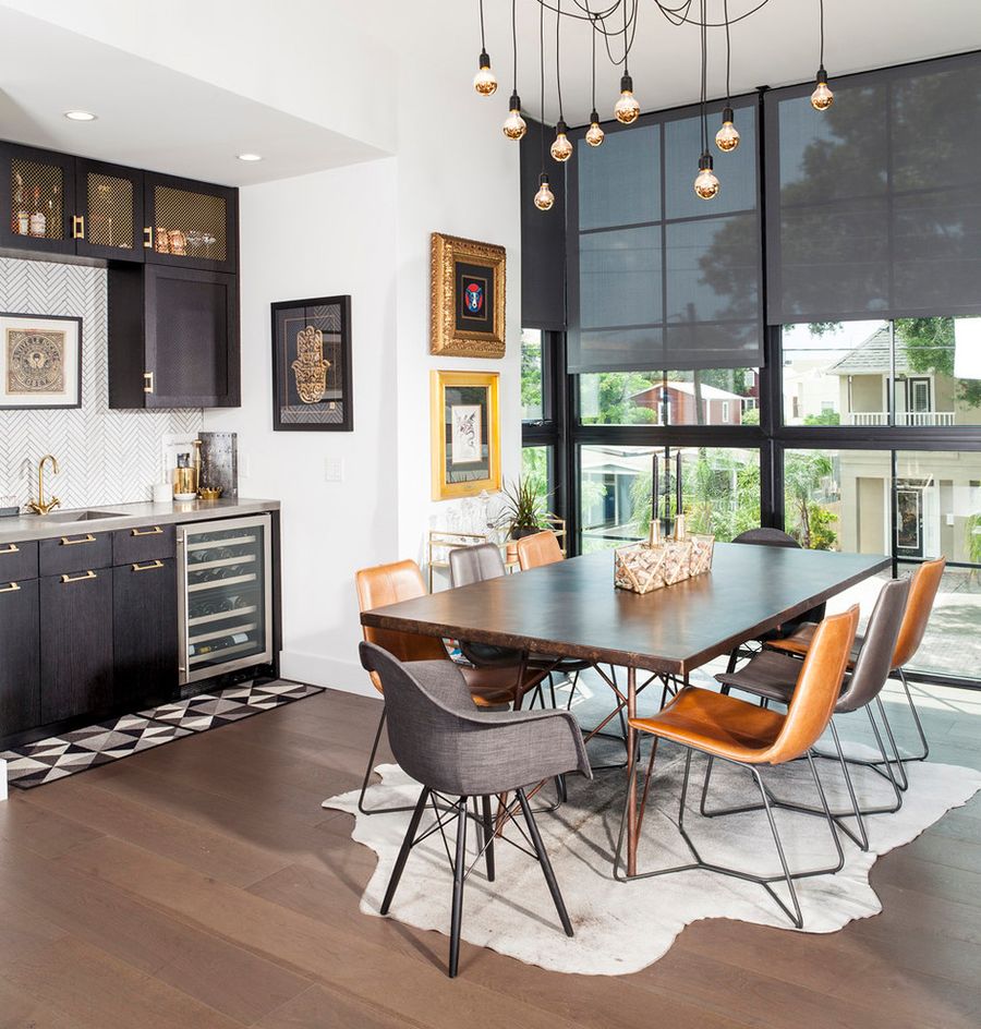 Bare light bulbs in urban industrial dining room via Joe Traina Photography