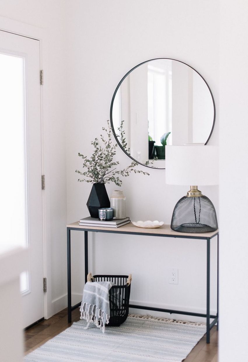 Black Accents - vase, mirror, console table in Scandinavian Entryway via 204park