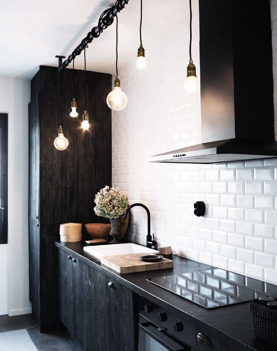 Black Cabinets and White Backsplash Tile in Industrial Kitchen Design