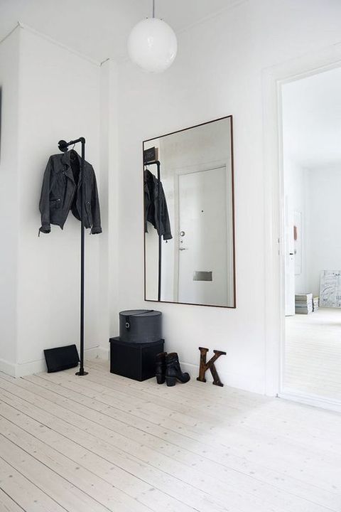 Black Iron Pipe for Hanging Coats in Scandi entryway design