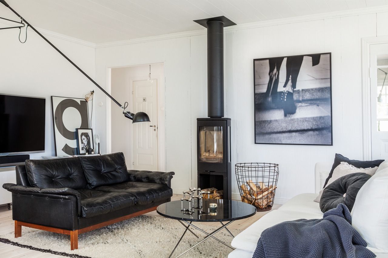 Black Leather Sofa Scandinavian Living Room via Pella Hedeby