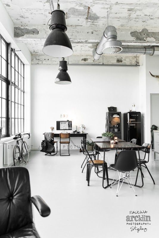 Black Smeg Fridge in Industrial Dining Room with Black Metal Accents