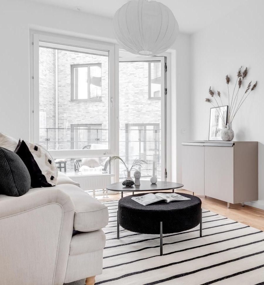 Black and White Striped Rug in Scandinavian Living Room via vaningen.se