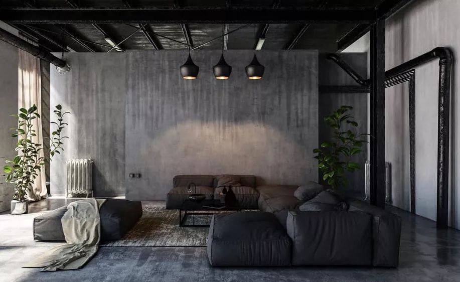 Black sofa in dark industrial living space