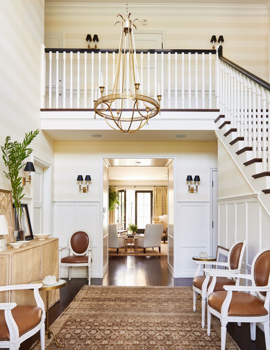 Brown Vintage Rug in Neutral Entryway via Mark D. Sikes