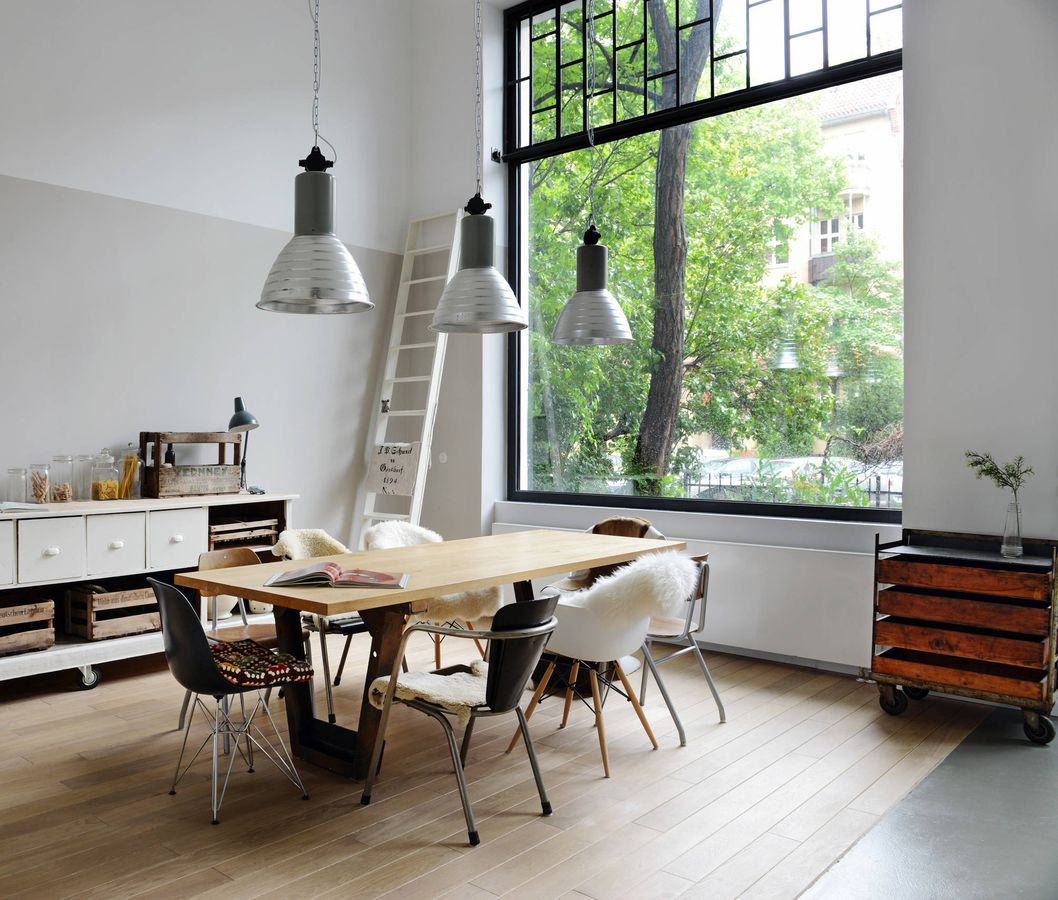 Buffet and Half Tone Wall in Industrial Dining Room decor via Studio Swen Burgheim