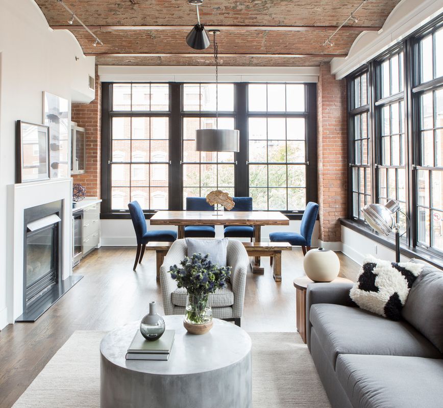 Concrete Coffee Table in Renovated Loft Industrial Living Room via hCO INTERIORS