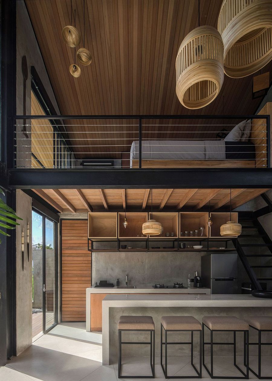 Concrete Kitchen Island, Concrete Backsplash, and Wood Ceiling Paneling in Industrial Kitchen via Biombo Architects