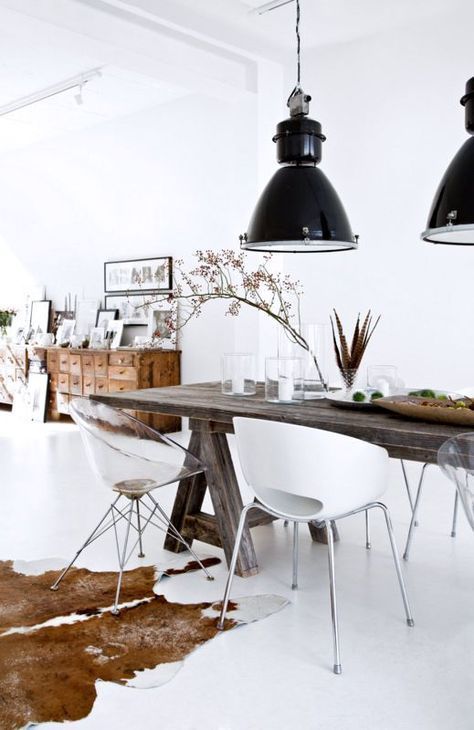 Cowhide Rug in Industrial Dining Room