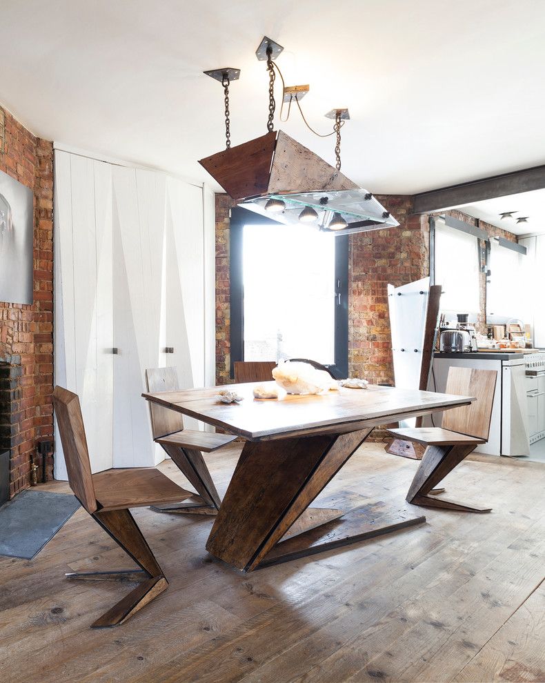 Custom Geometric Dining Furniture in Industrial Dining Room via Nathalie Priem for Domus Nova Design