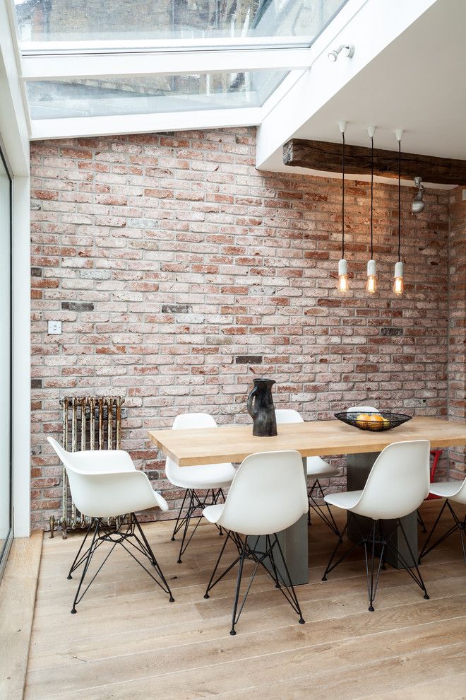 Eames Molded Dining Chairs in Industrial Dining Room via SR interior design