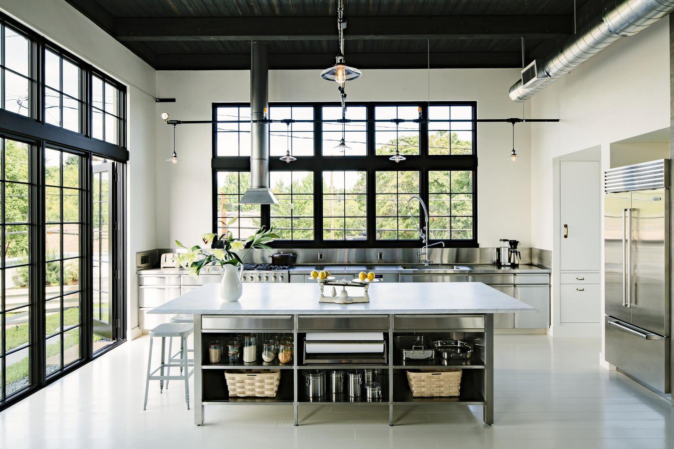 Exposed Metal Ducts in Industrial Style Kitchen via Emerick Architects