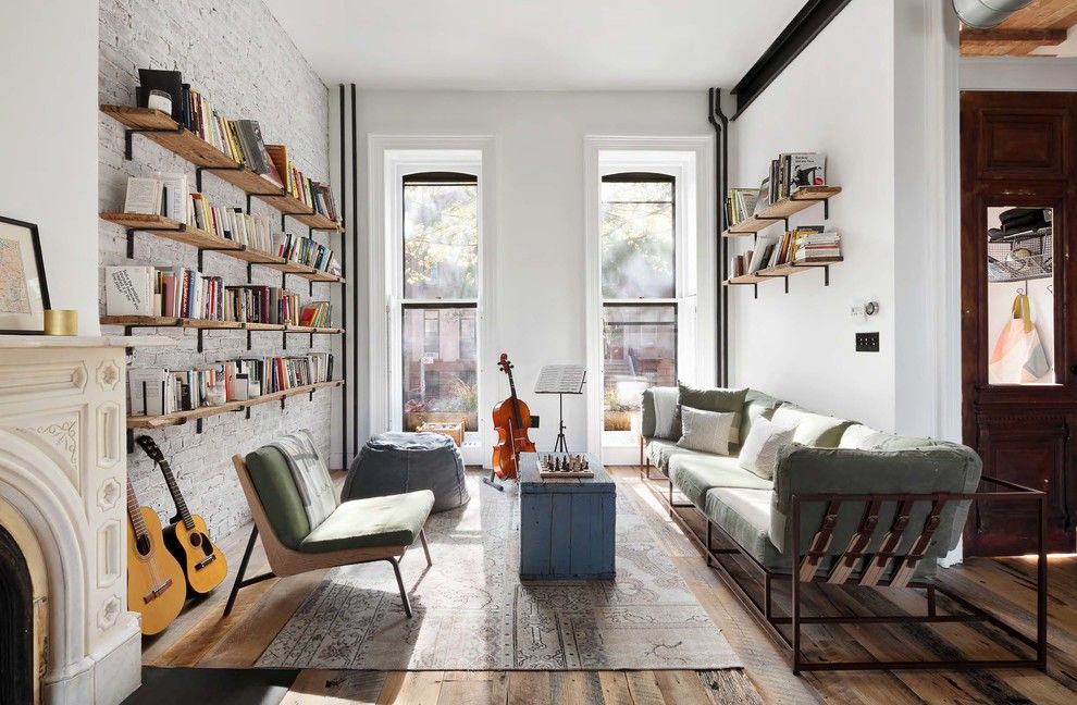 Floating Bookshelves on Wall of Industrial living room via Murdock Solon Architects