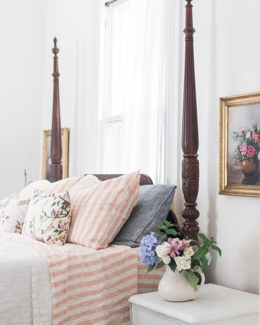 Flowers in a White Pitcher on the Nightstand in Farmhouse Spring Bedroom Decor via @farmhouseonboone