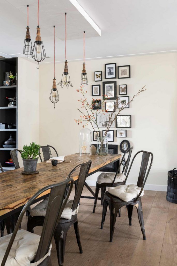 Gallery Wall with Black Frames in Industrial Dining Room via Style-Files Studio Bril