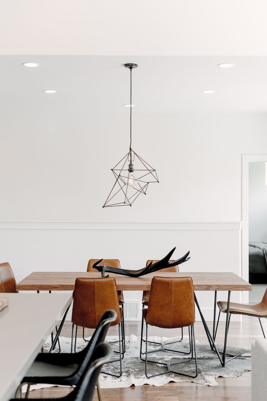 Brown Leather Dining Chairs with Black metal legs in Industrial Dining Room Decor and Furniture via Mikelle Mabey