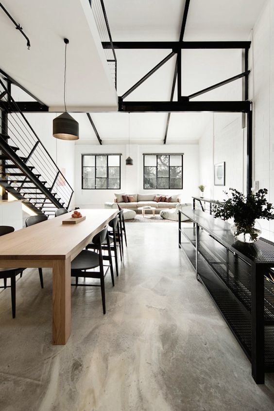 Industrial Dining Room with Exposed Metal Beams