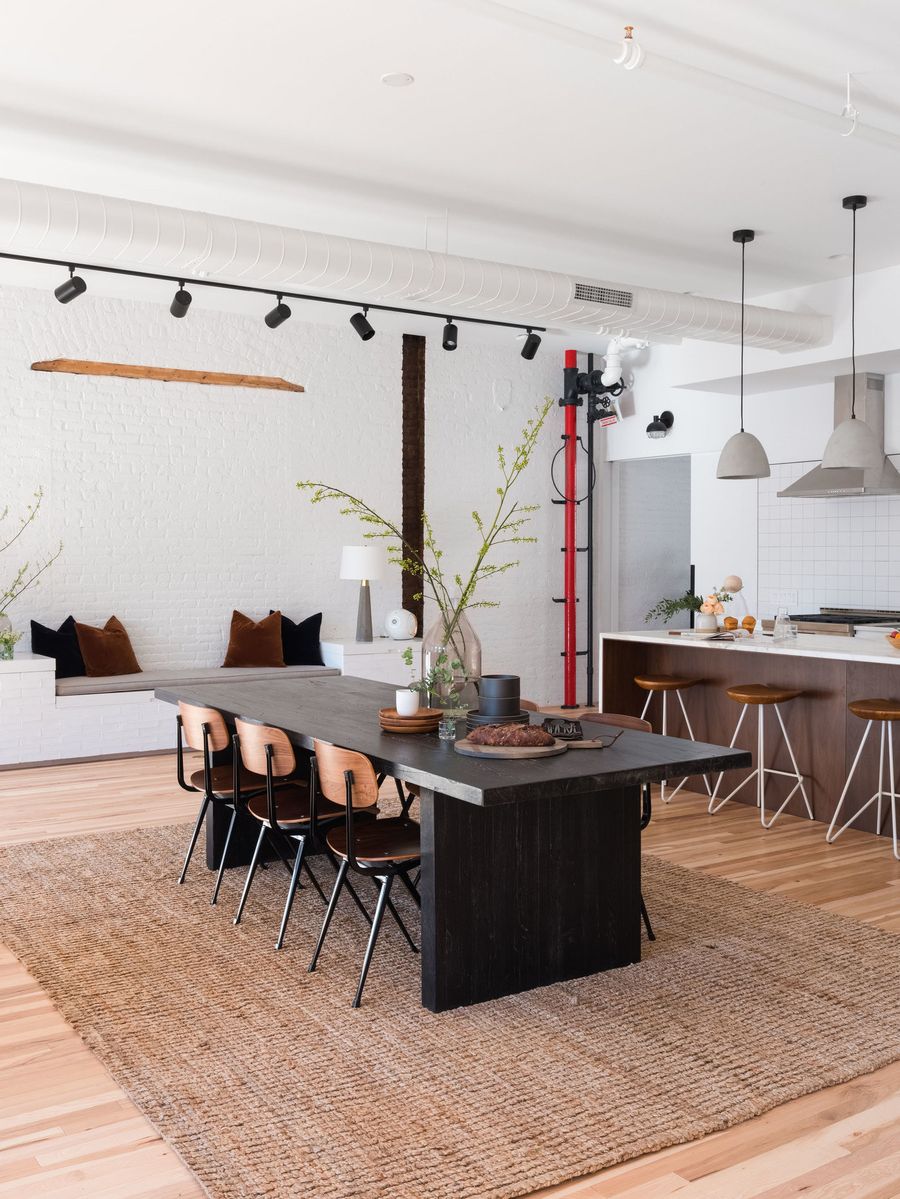 Jute woven rug in Modern Industrial dining room design via Stitchroom