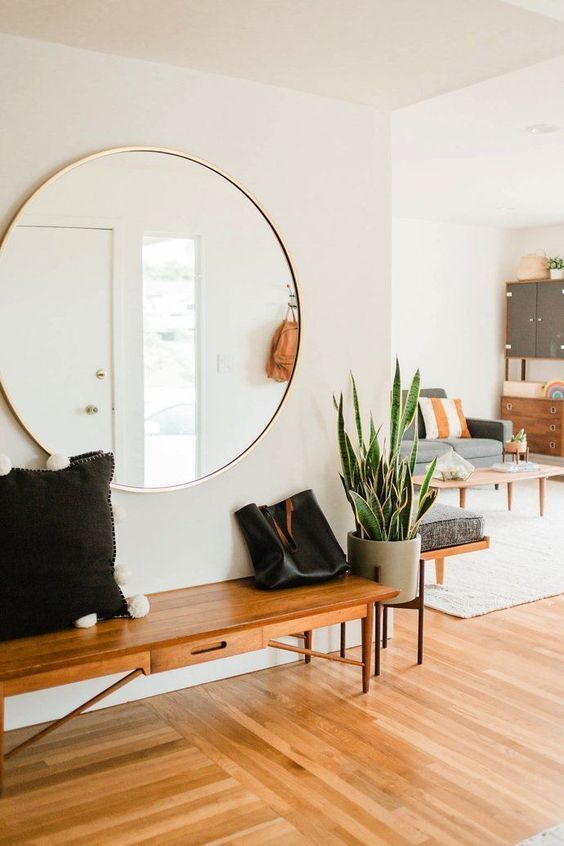 Large Round Wall Mirror in Mid-Century Modern Entryway