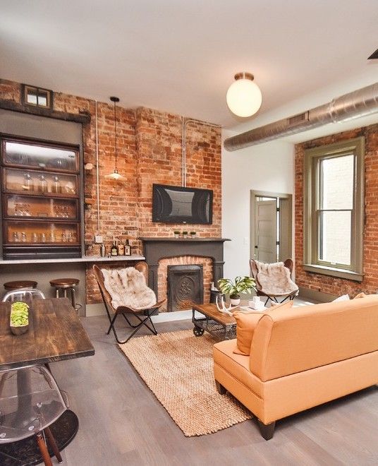 Leather Butterfly Accent Chair in Industrial Living Room via Finn Team Coldwell Banker
