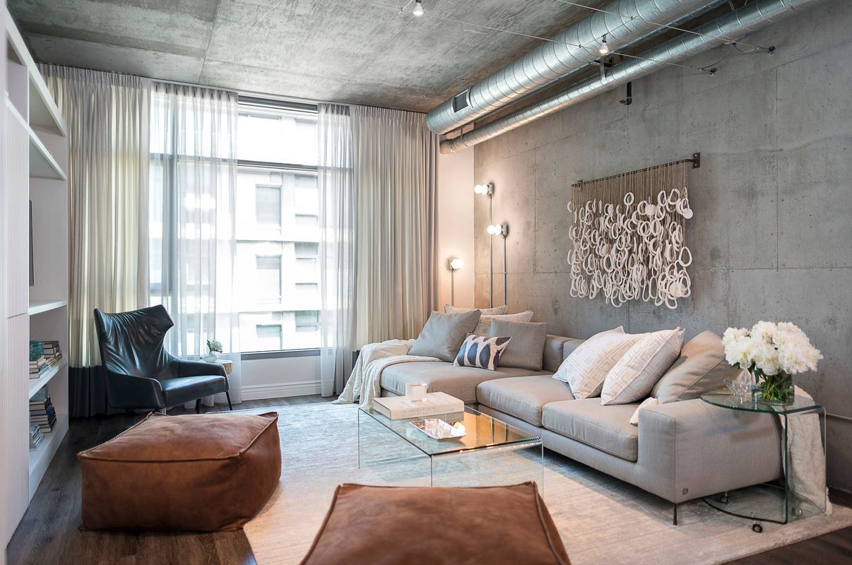 Light Gray Sectional Sofa in Modern Industrial living Room via Four Point design build inc