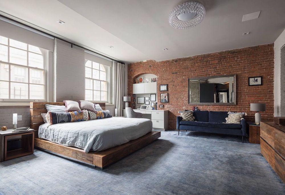 Painted White Brick Wall and Wood Platform Bed in Industrial Bedroom Design by Simonian Rosenbaum Architects