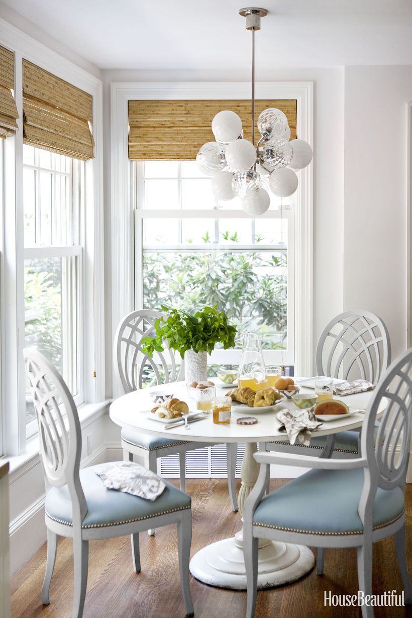 Pale Blue Seat Cushions in Breakfast Nook via House Beautiful