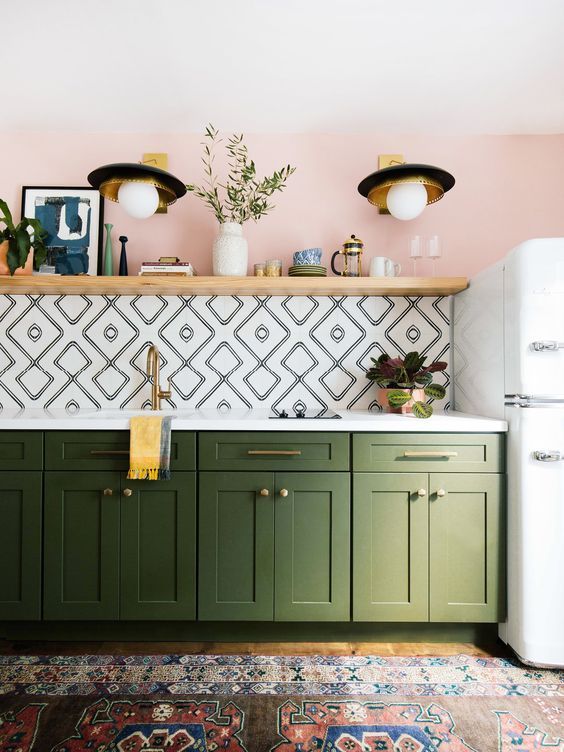 Pink Painted Wall with Black and White Backsplash Tile and Green Cabinets, Boho vintage rug, Bohemian Kitchen Ideas